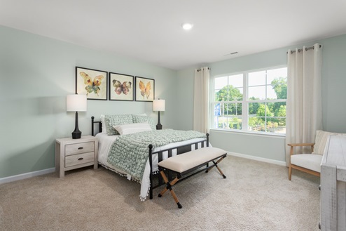 bedroom with carpet and natural light