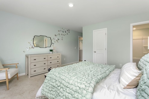 bedroom with carpet and natural light