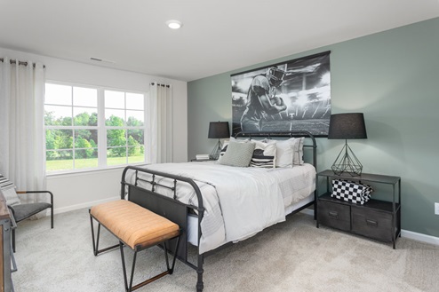 bedroom with carpet and natural light