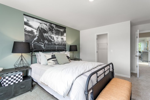 bedroom with carpet and natural light