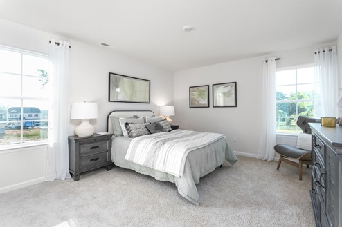bedroom with carpet and natural light