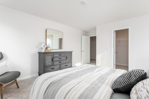 bedroom with carpet and natural light