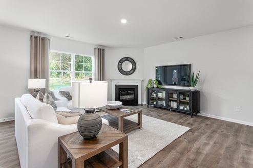 living room with revwood floors and natural light