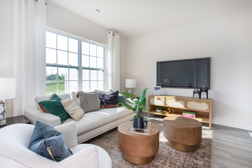 living room with revwood floors and natural light