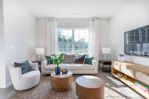 living room with revwood floors and natural light