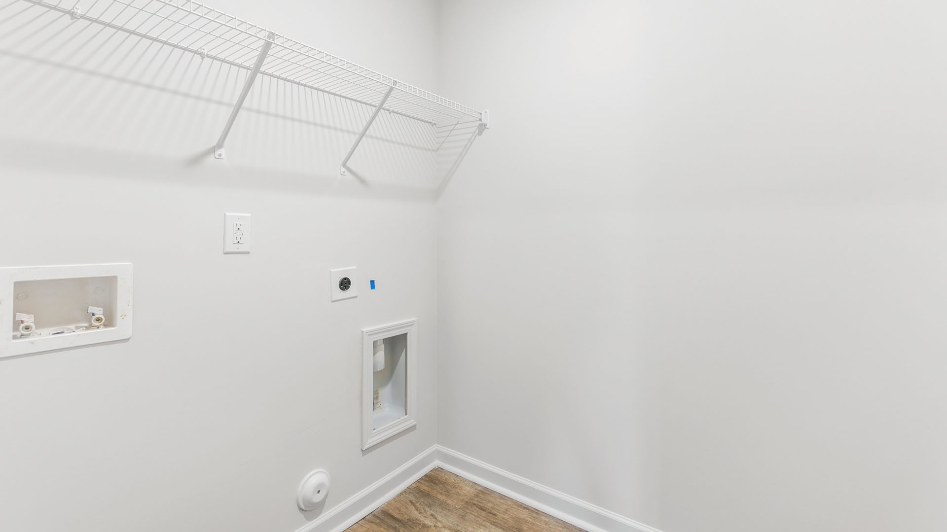 laundry room with wire shelving