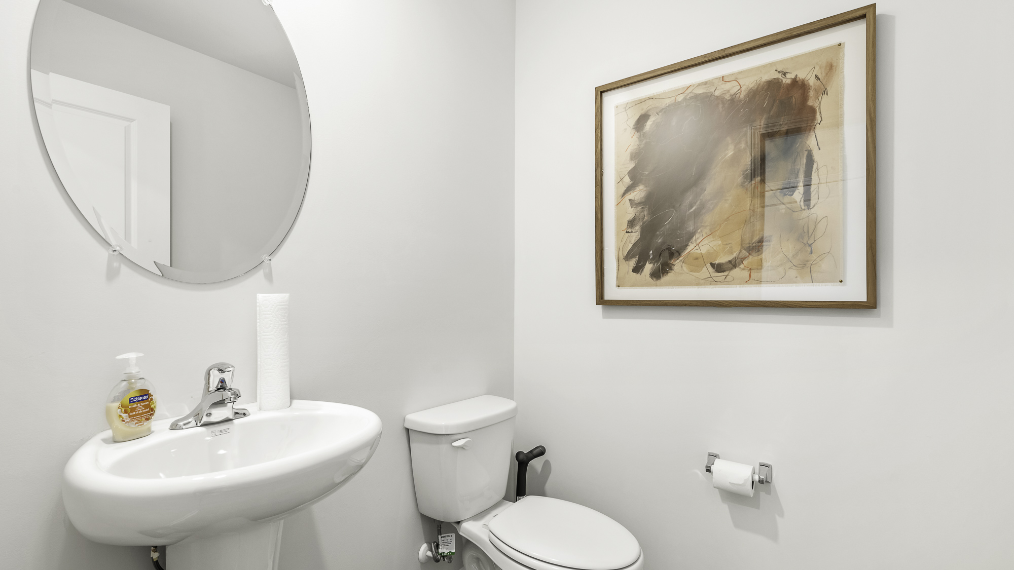 half bathroom with a pedstal sink