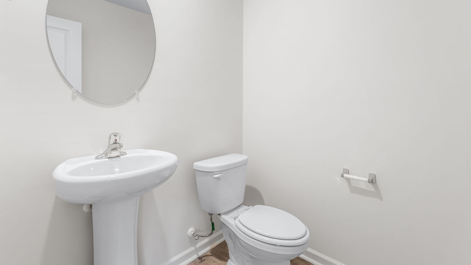 half bath with a pedastool sink
