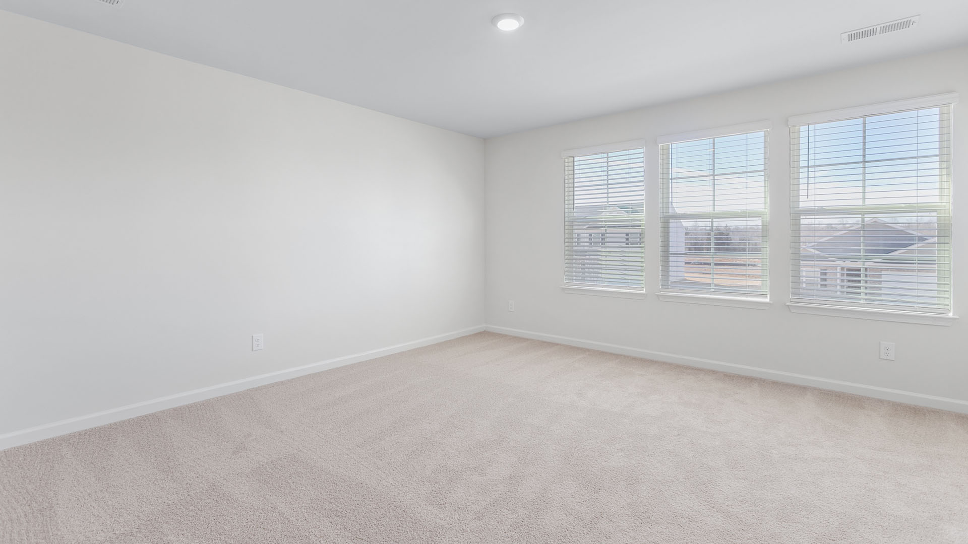 bedroom with 3 large windows