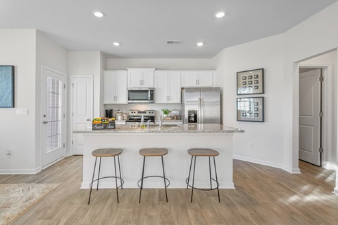 kitchen with large kitchen island and can lighting