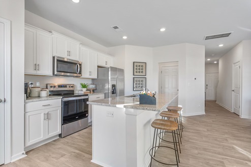 kitchen with large kitchen island and can lighting