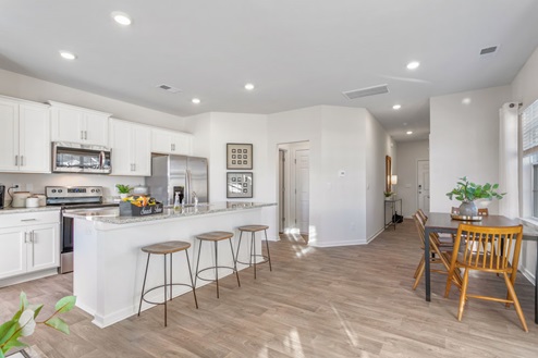 kitchen with large kitchen island and can lighting