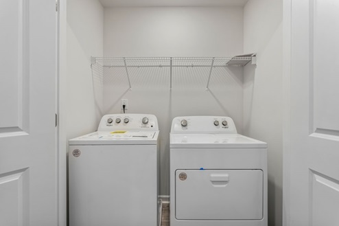 Laundry room with shelving