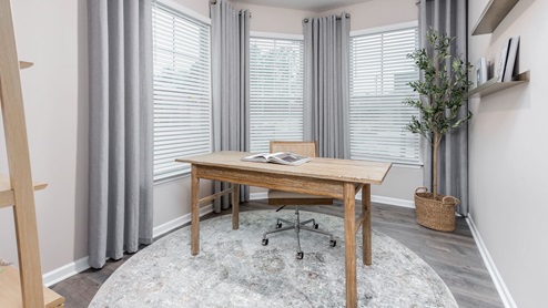 Office located down stairs with 3 large windows