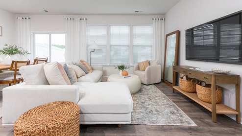 living room with revwood floors and natural light