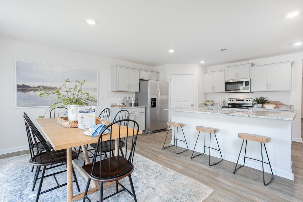dining room with vinal floor and natural light