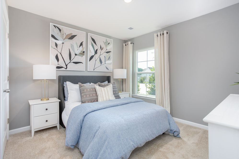 bedroom with carpet and natural light