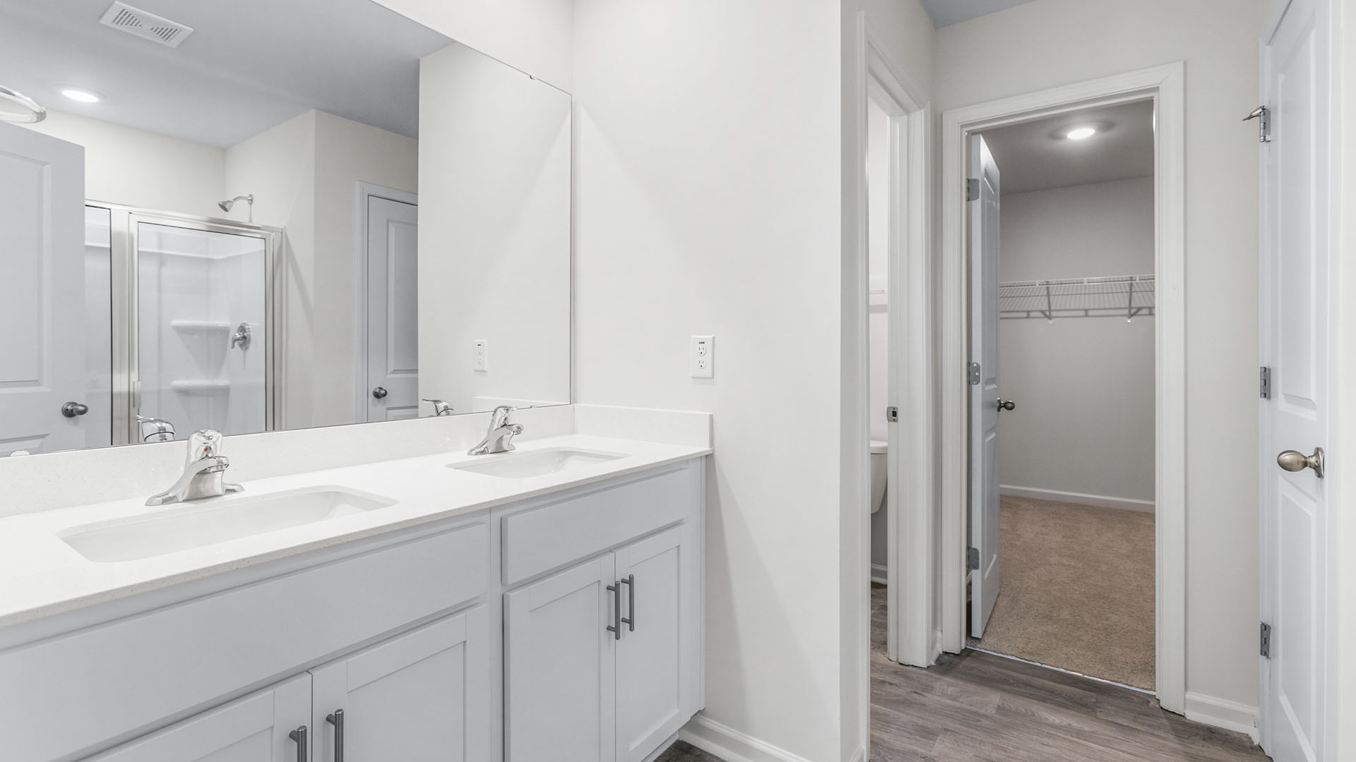 primary bathroom with dual sinks