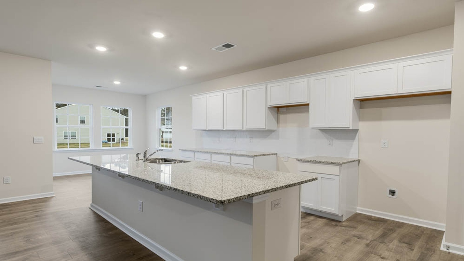 side view of kitchen with gray cabinets