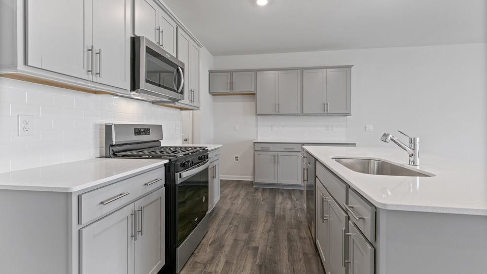 Middle kitchen view with gray cabinets