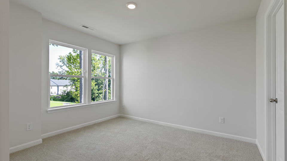 primary bedroom with window view