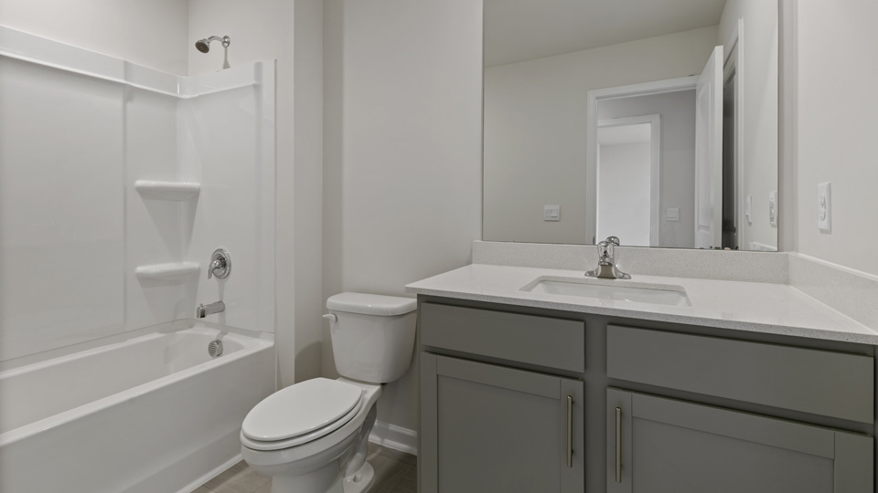 secondary bathroom with tub shower combo
