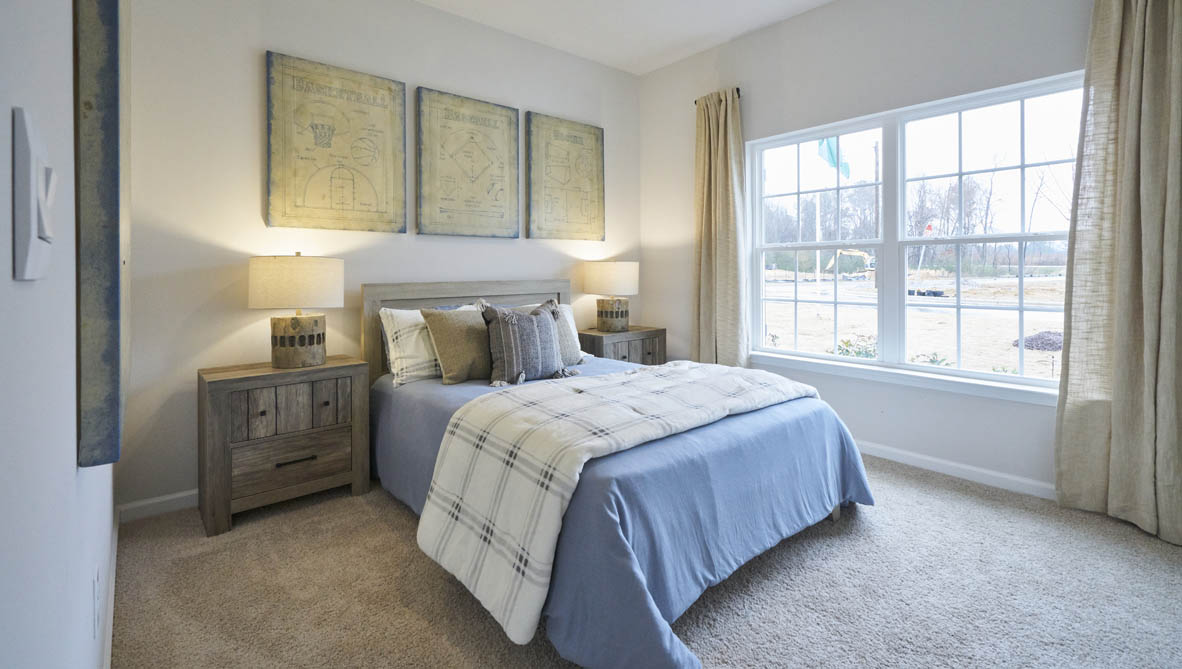 bedroom with carpet and natural light