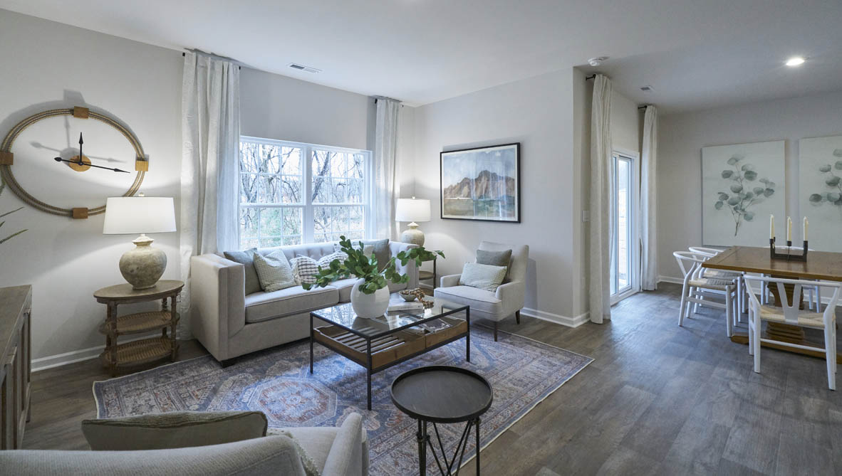 living room with vinyl floor and natural light