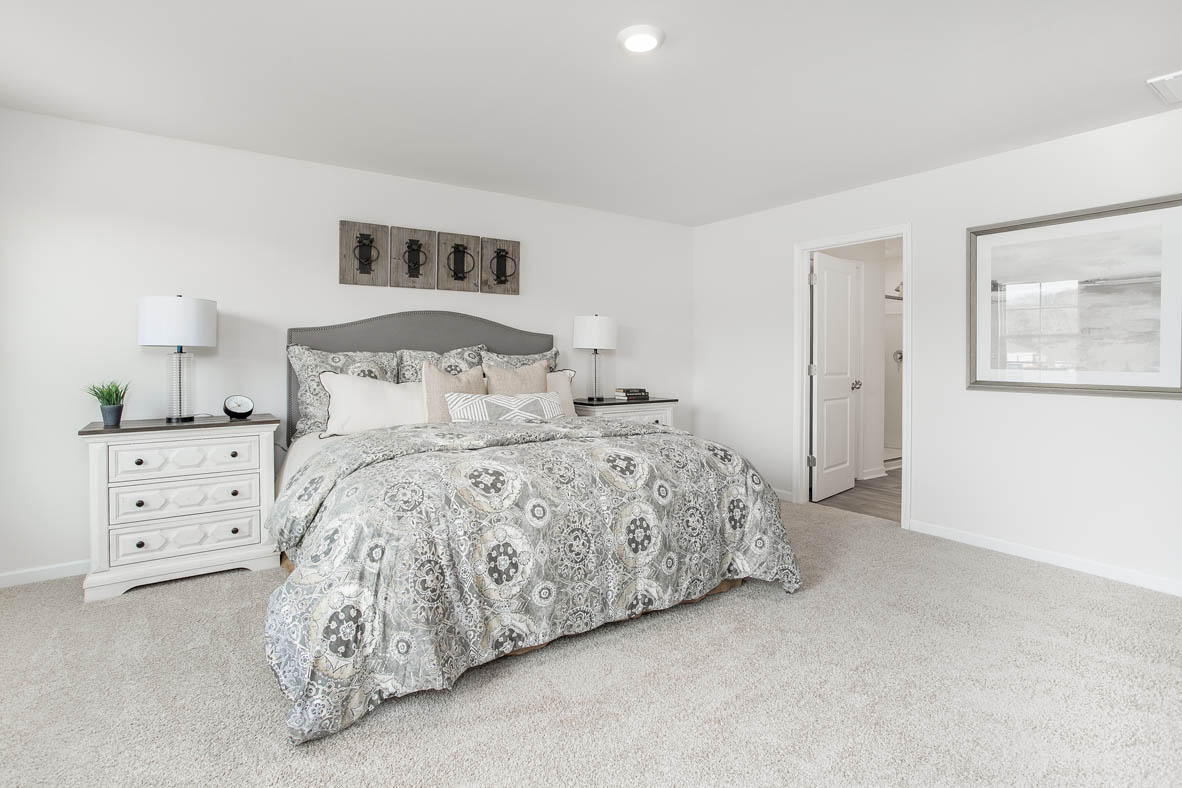 bedroom with carpet and natural light