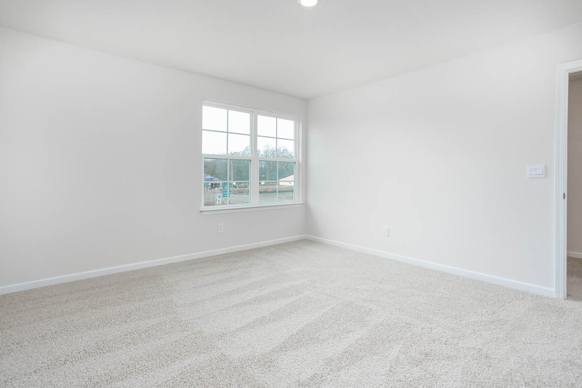 bedroom with carpet and natural light