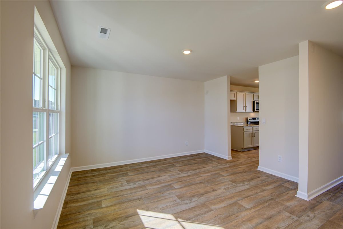living room with vinyl floor and natural light