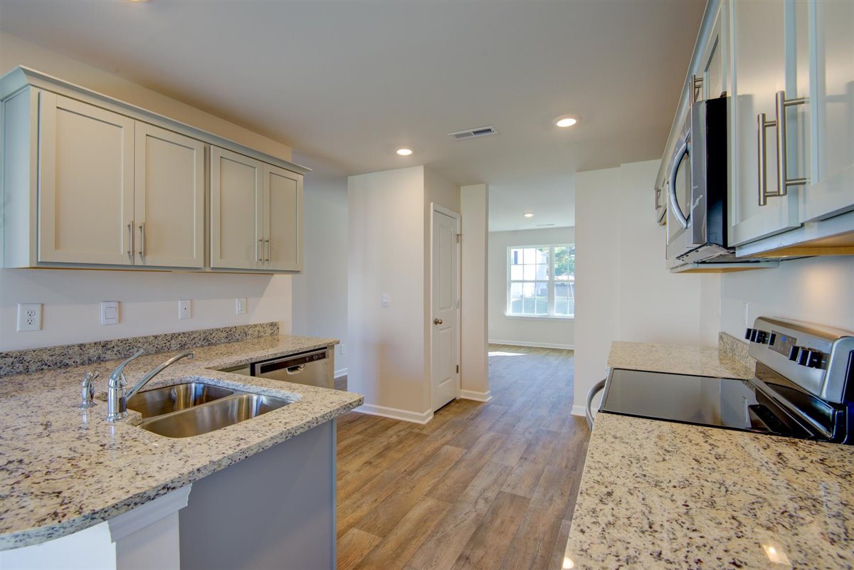 kitchen with vinyl floor and stainless steel appliances