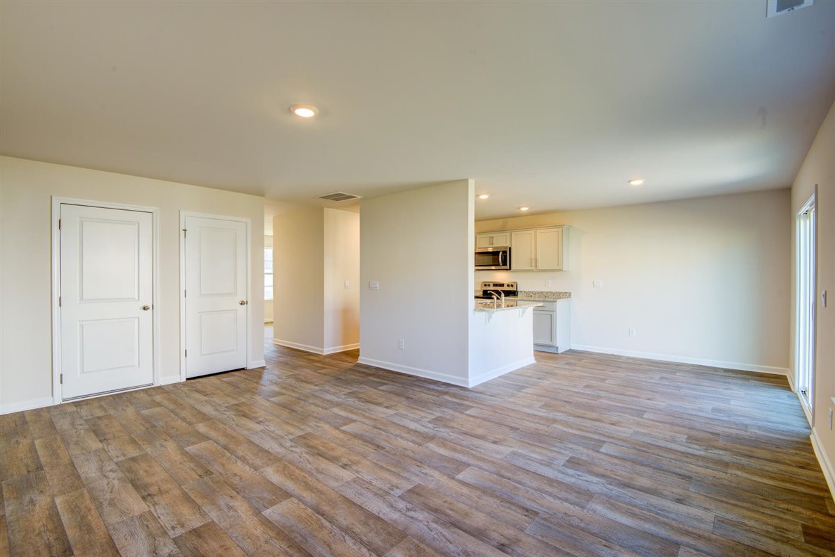 living room with vinyl floor and natural light