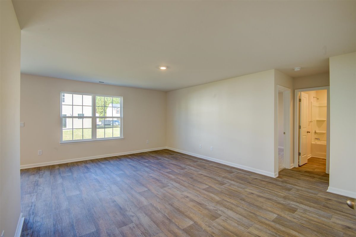 living room with vinyl floor and natural light