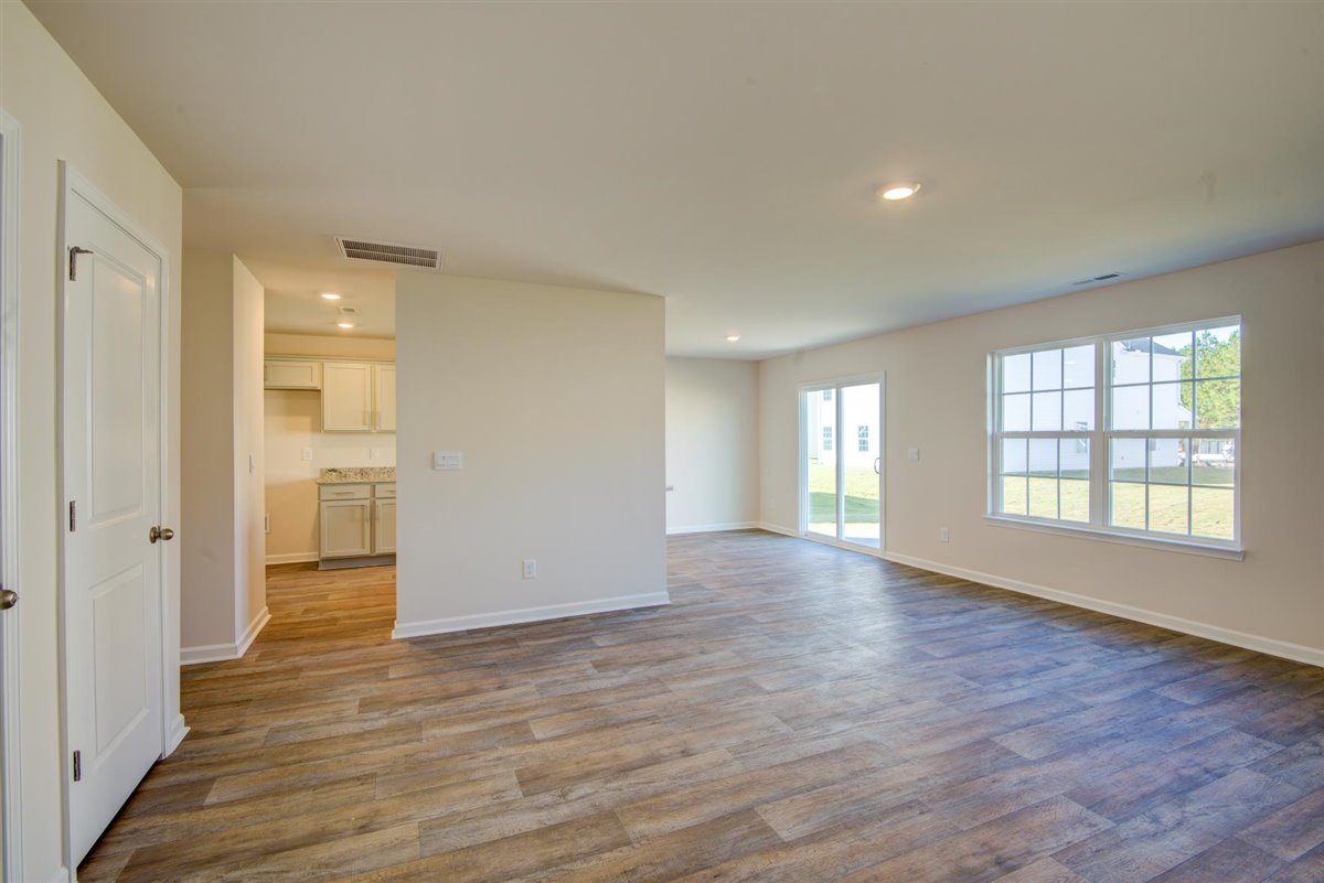 living room with vinyl floor and natural light