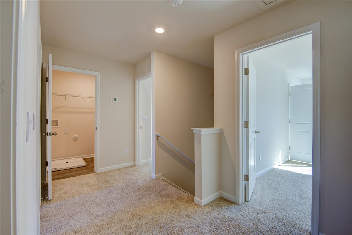 upstairs hallway with carpet