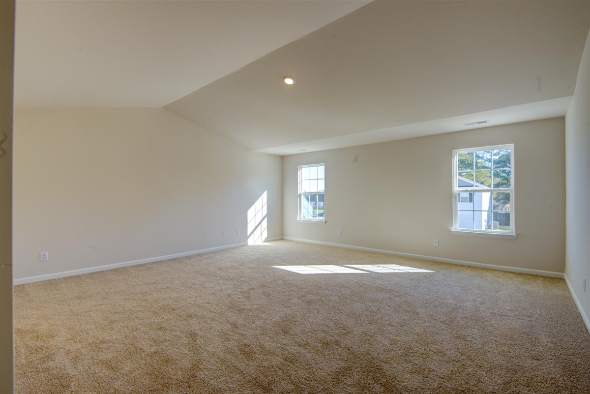 bedroom with carpet and natural light