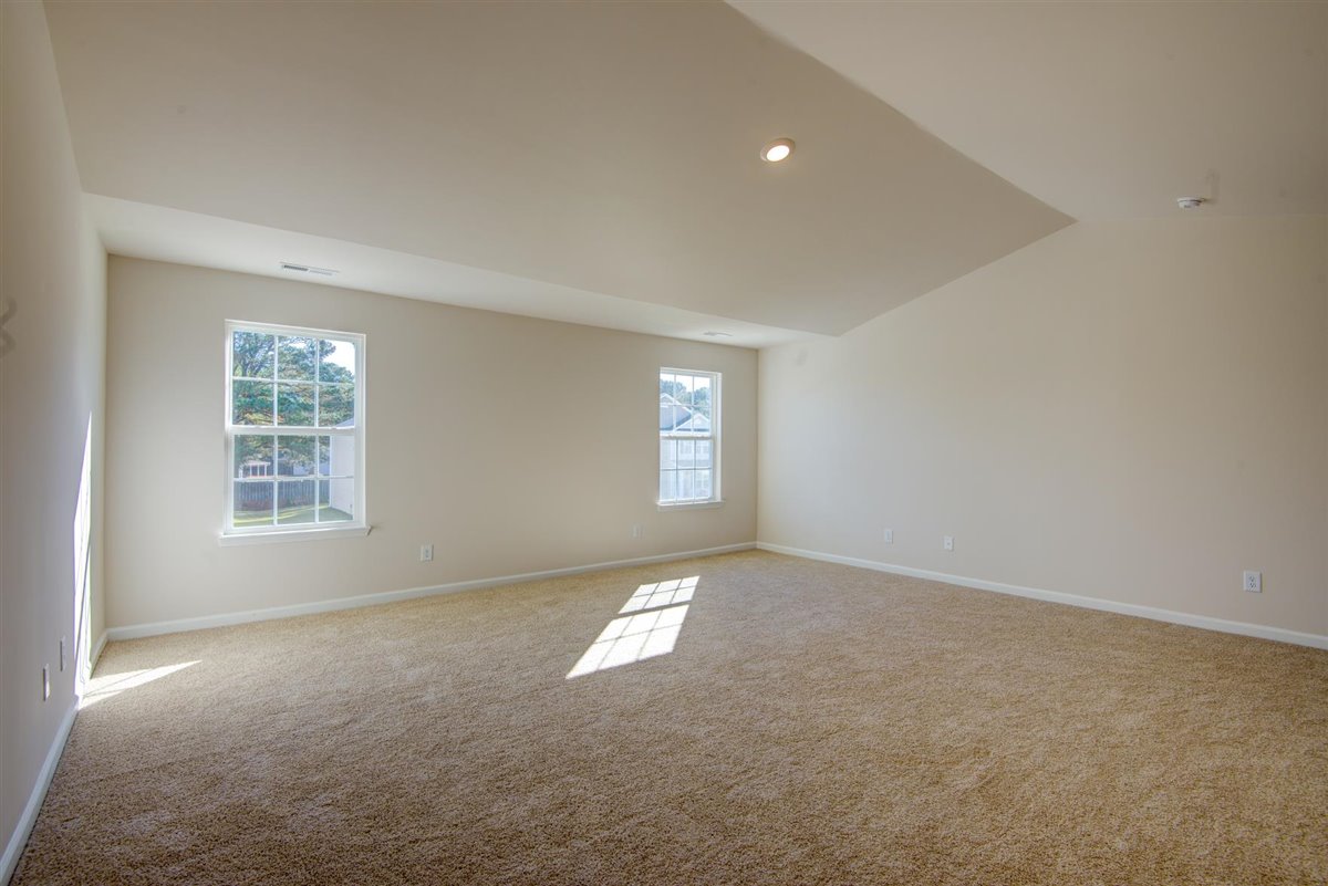 bedroom with carpet and natural light