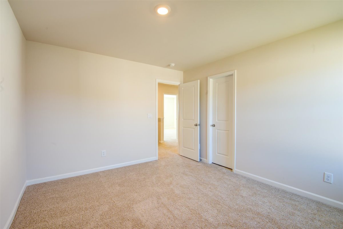 bedroom with carpet and natural light