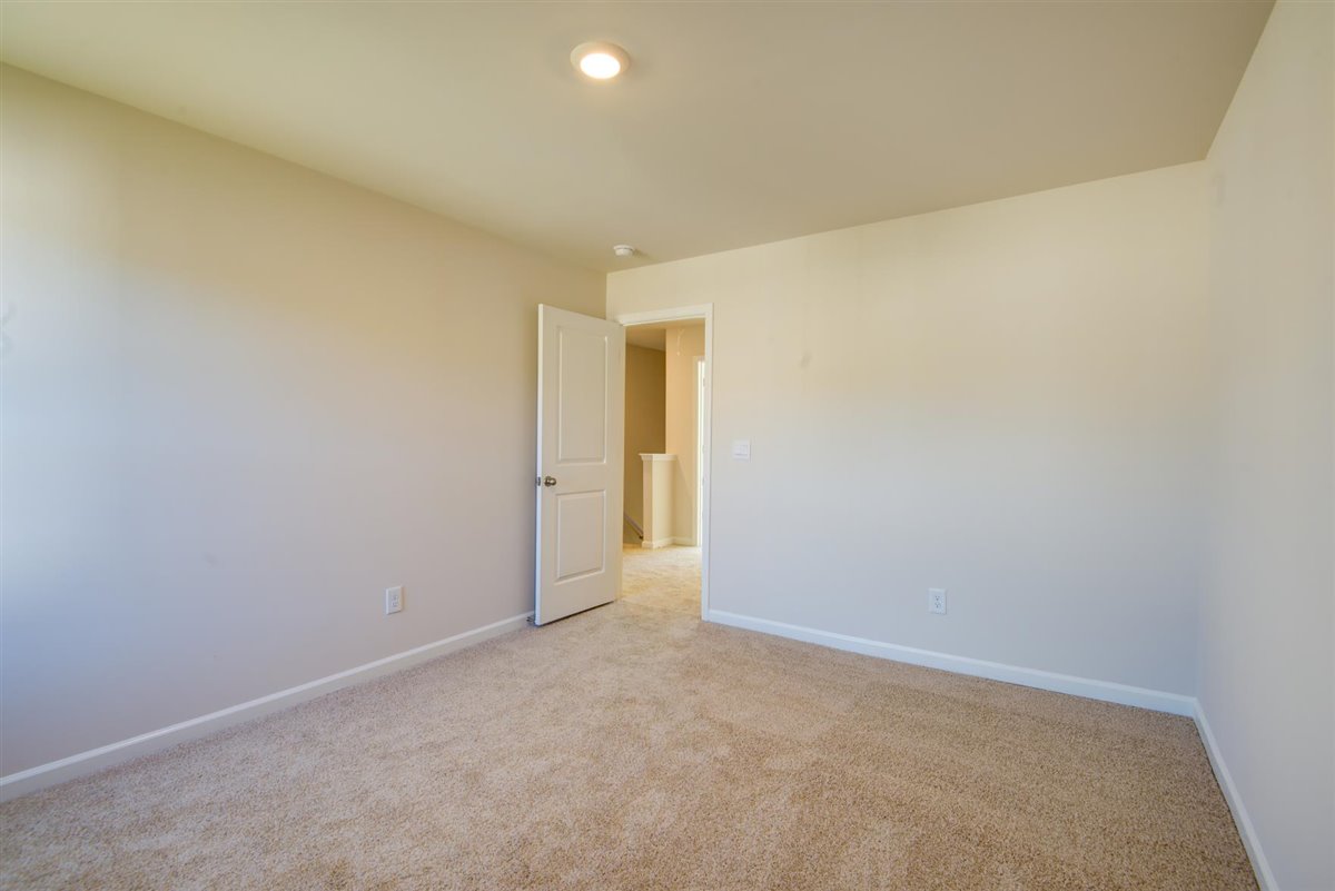 bedroom with carpet and natural light