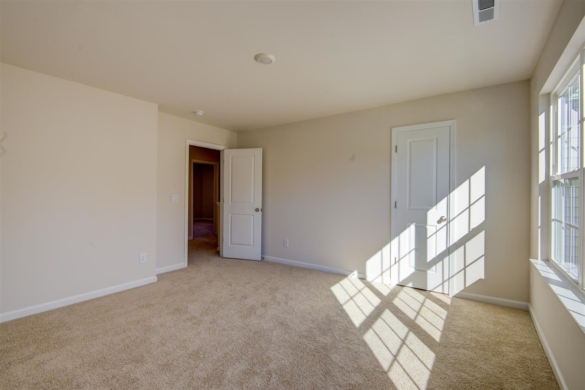 bedroom with carpet and natural light