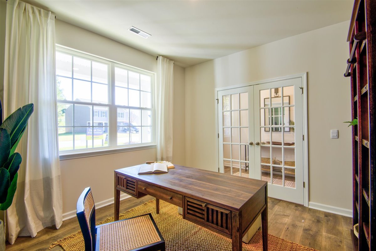 foyer with vinyl floor and french door