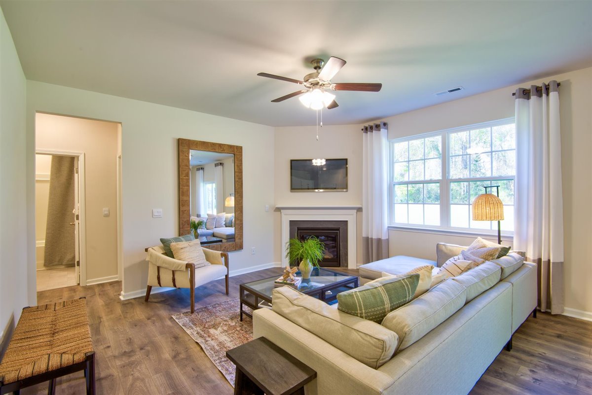living room with vinyl floor and natural light