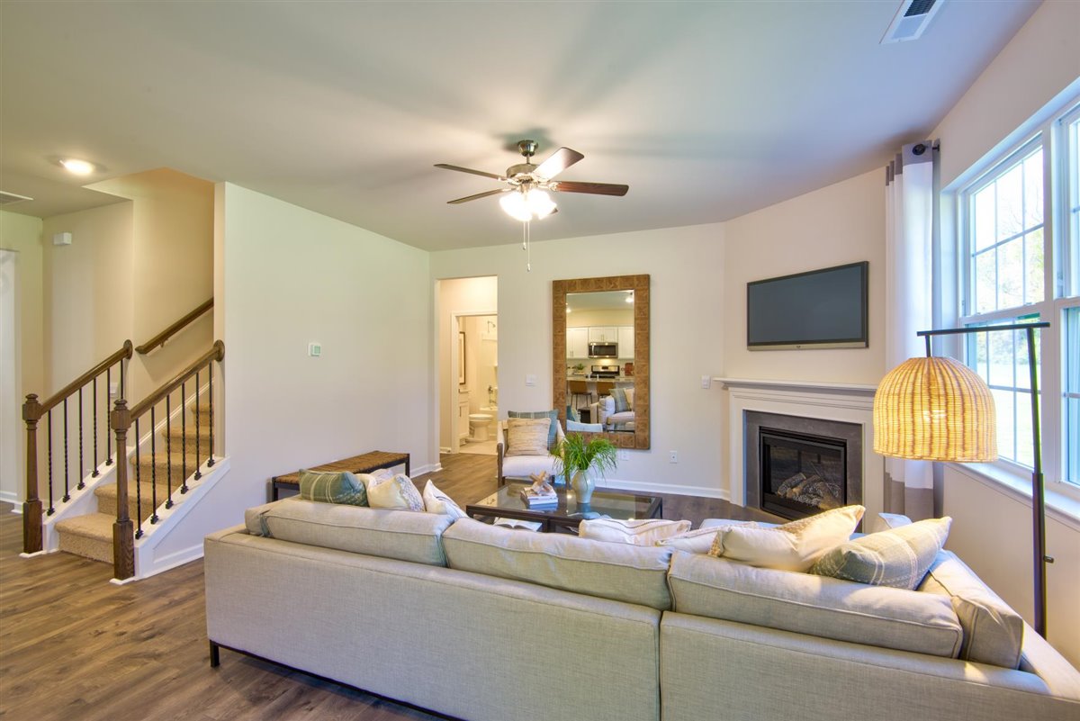 living room with vinyl floor and natural light