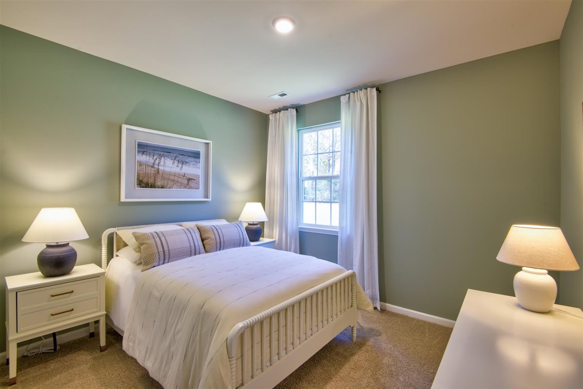 bedroom with carpet and natural light