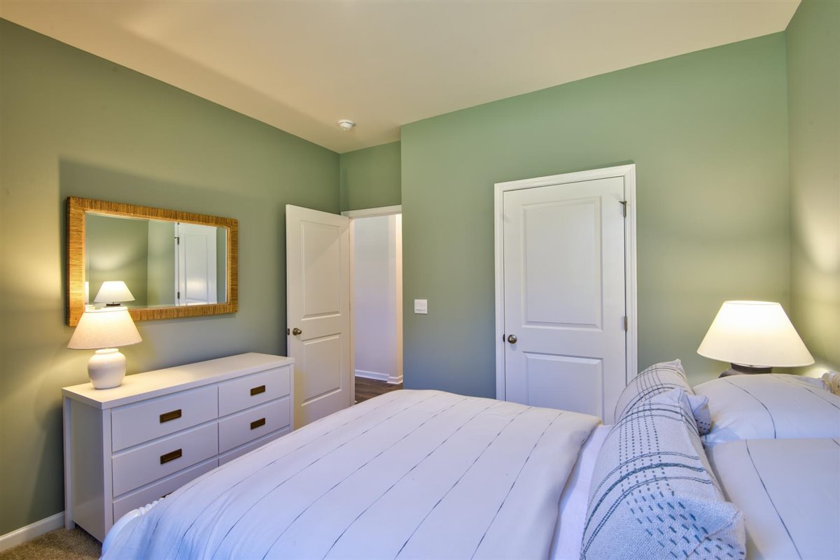 bedroom with carpet and natural light