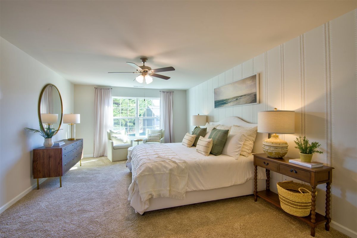 bedroom with carpet and natural light