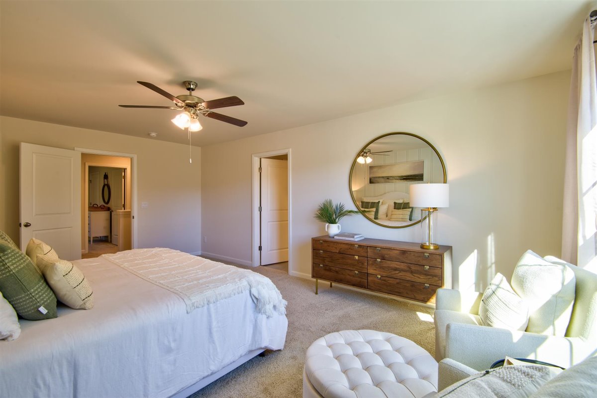 bedroom with carpet and natural light