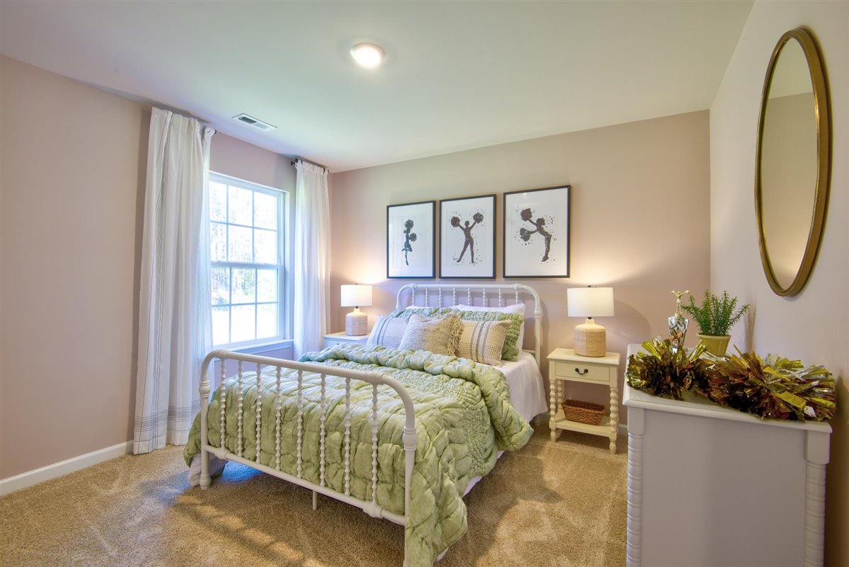 bedroom with carpet and natural light