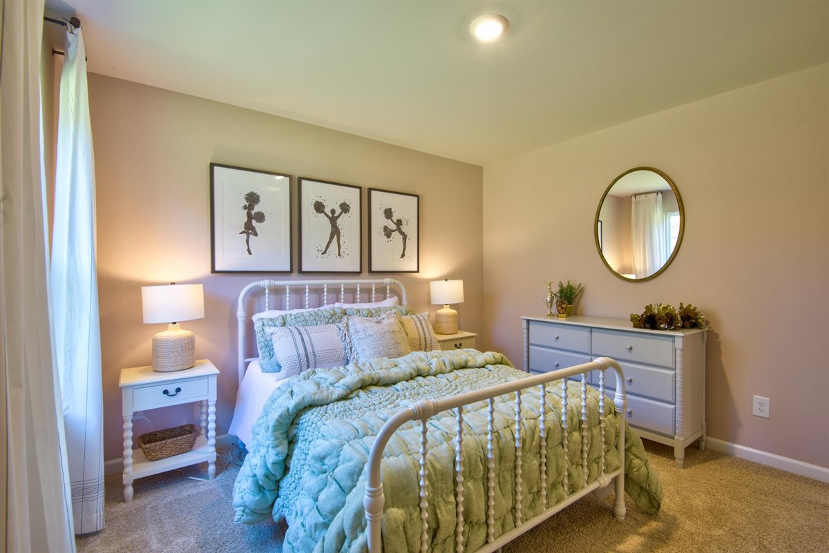 bedroom with carpet and natural light